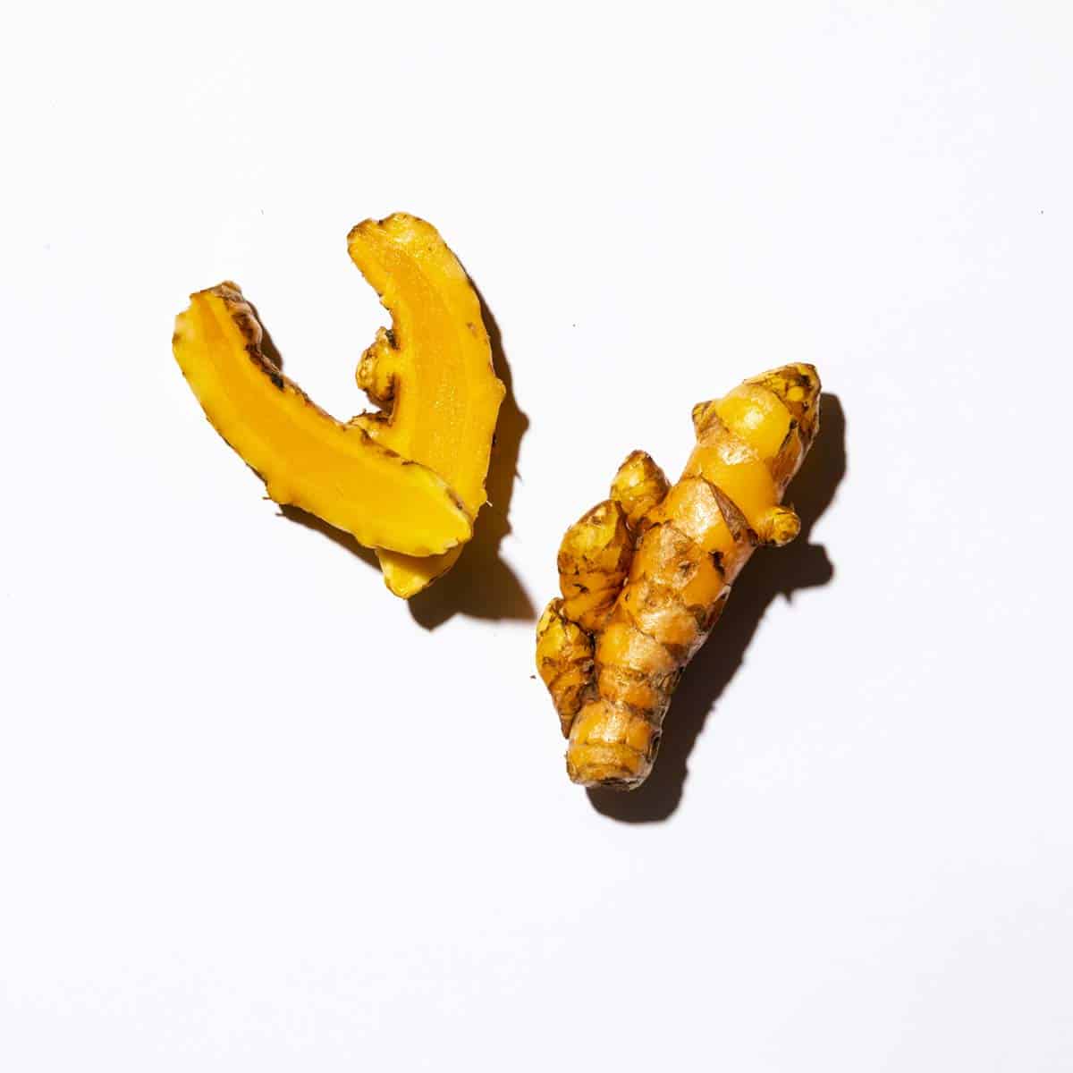 turmeric root on white background
